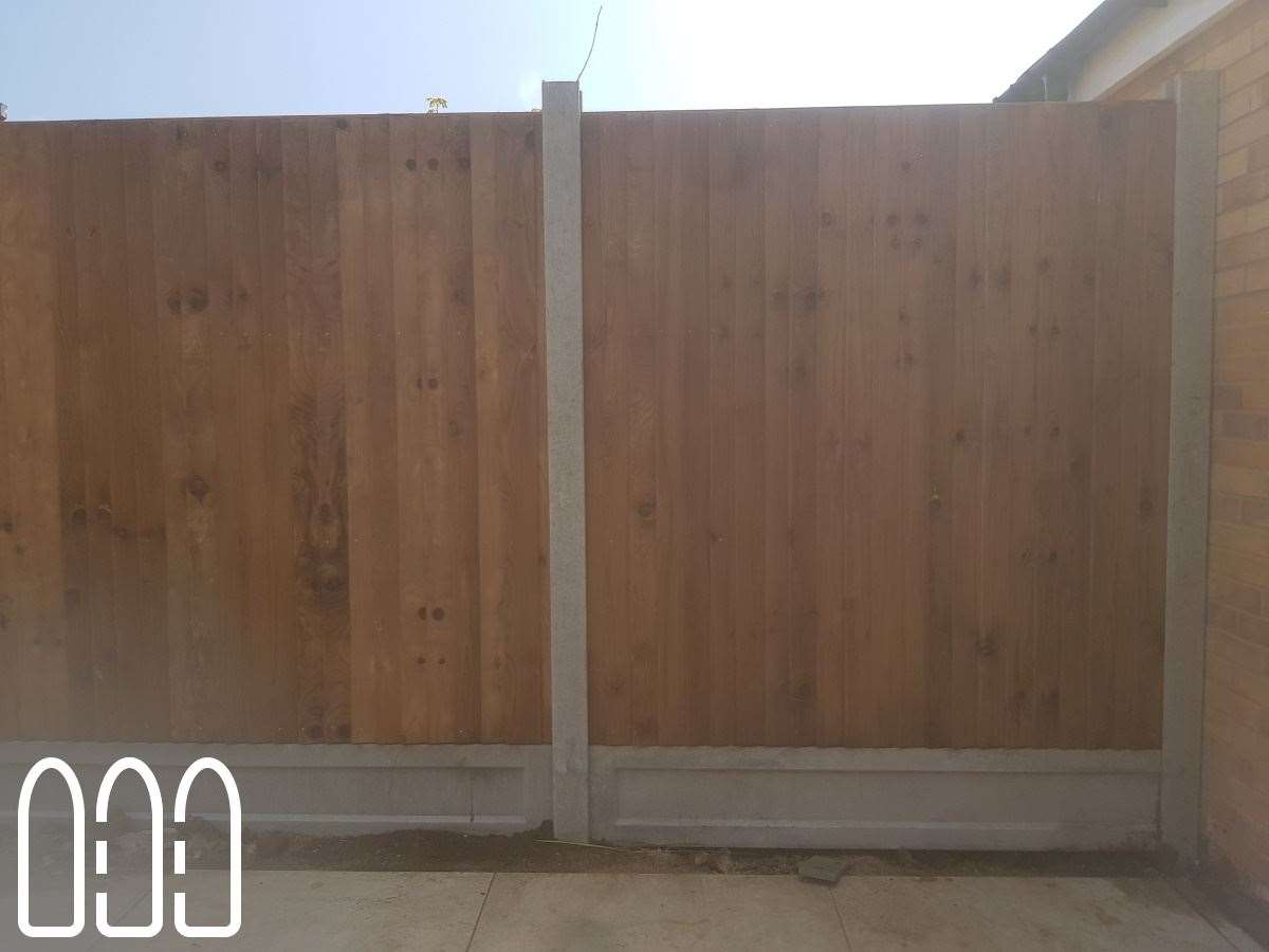 Close board fencing with concrete posts and gravel boards