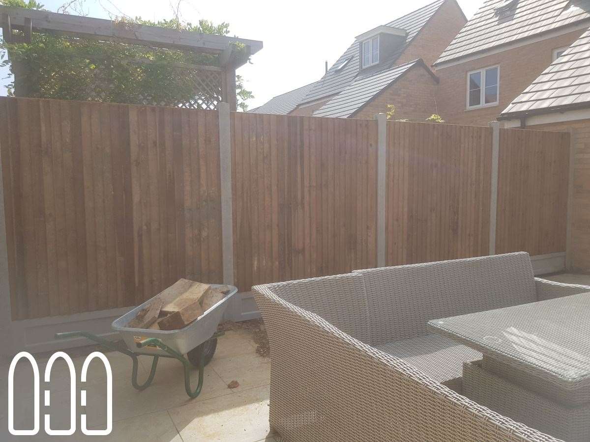 Close board fencing with concrete posts and gravel boards