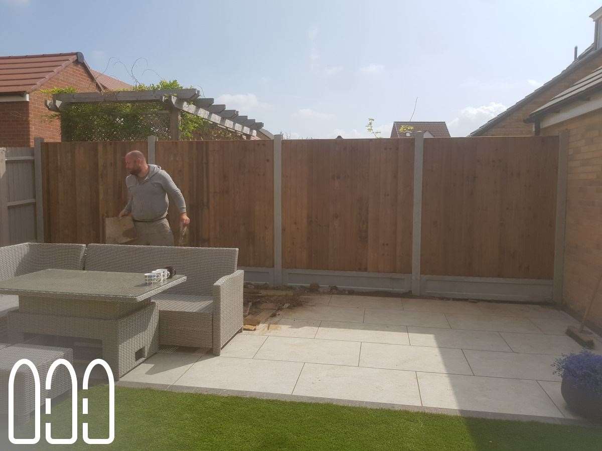 Close board fencing with concrete posts and gravel boards