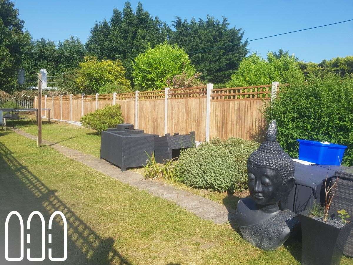 Close board fencing with concrete posts, gravel boards and a box trellis