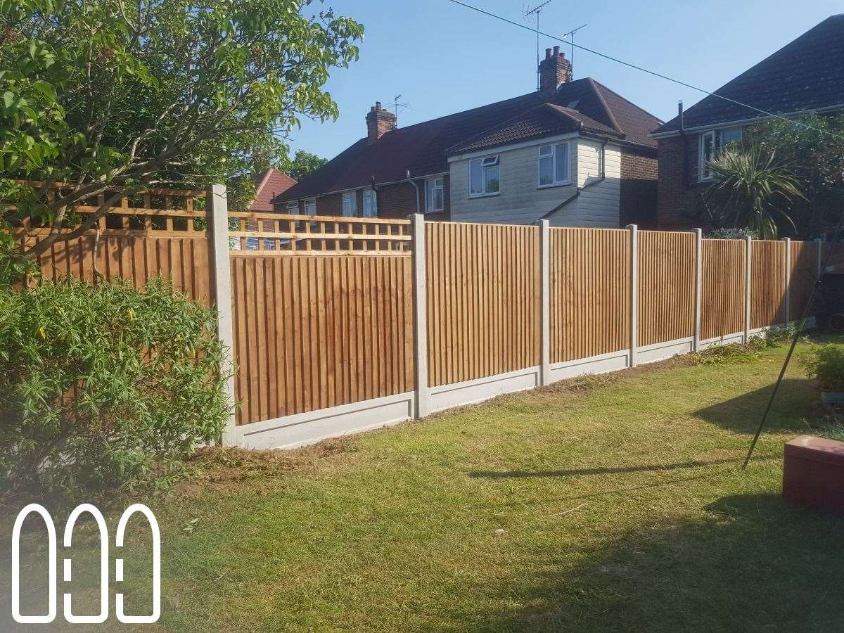 Close board fencing with concrete posts, gravel boards and a box trellis