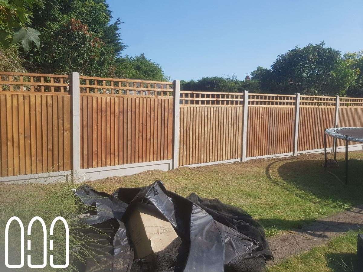 Close board fencing with concrete posts, gravel boards and a box trellis