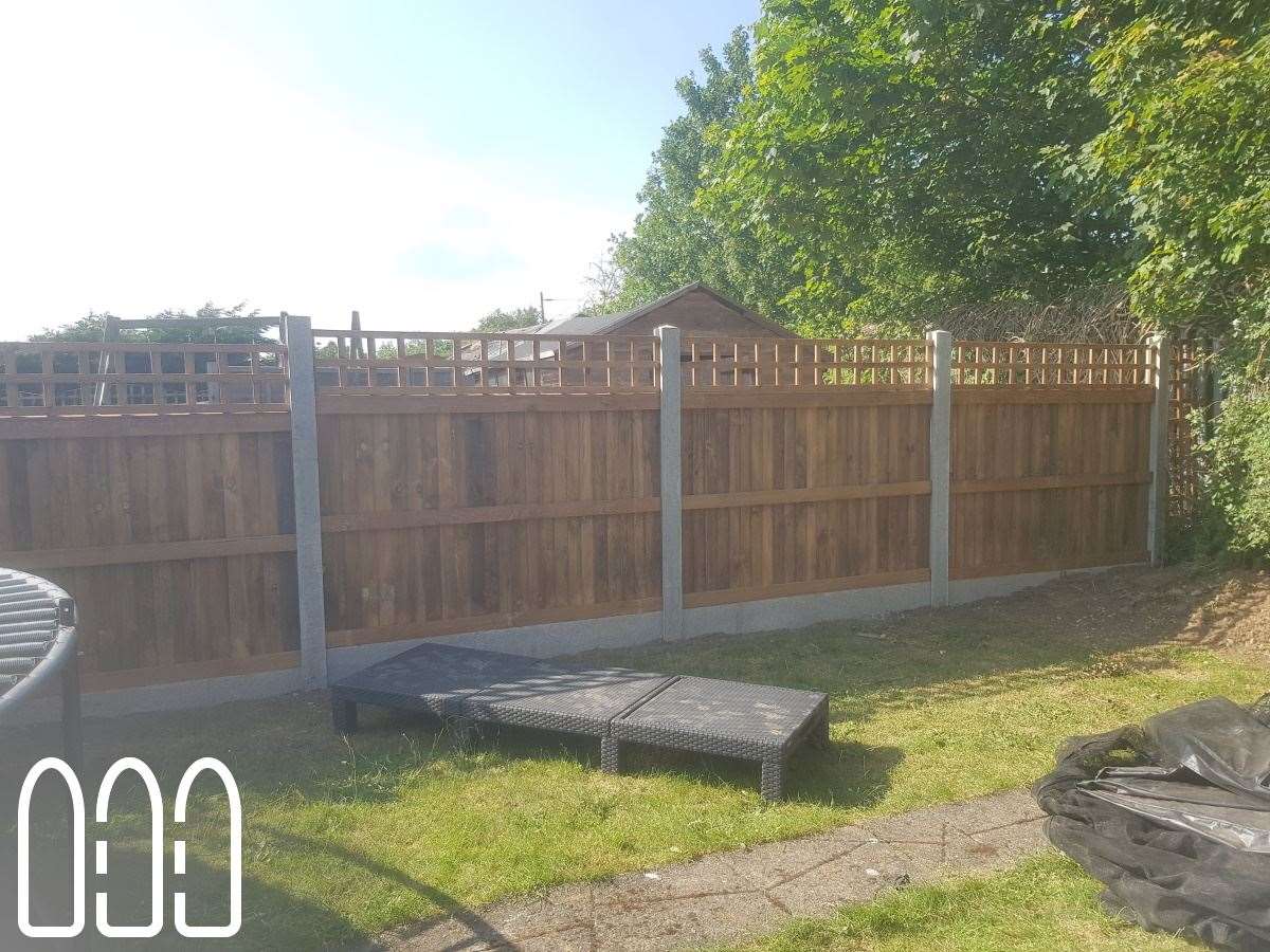 Close board fencing with concrete posts, gravel boards and a box trellis