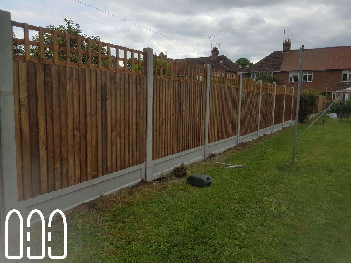 Close board fencing with concrete posts, gravel boards and a box trellis