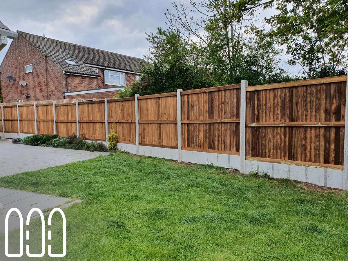 Close board fencing with concrete posts and gravel boards