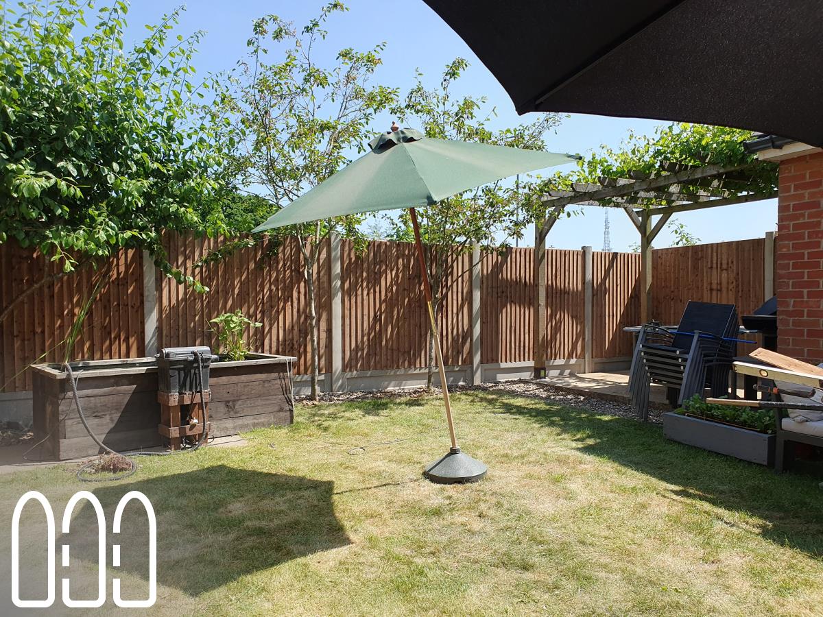 Installation of a new fence built from concrete posts, concrete gravel boards and close board feather edge fence panels.