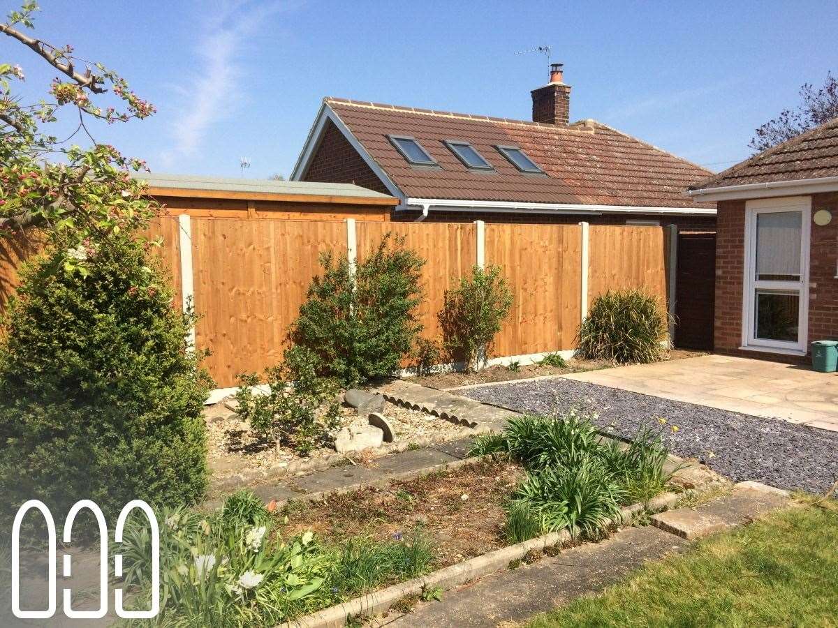 Close board fencing with concrete posts and gravel boards