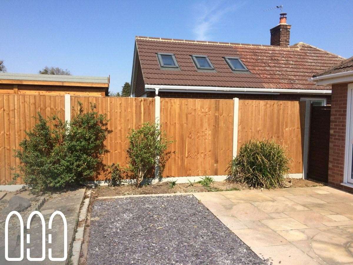 Close board fencing with concrete posts and gravel boards