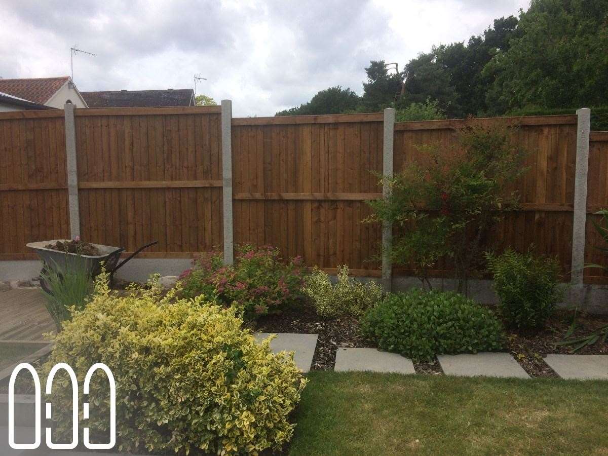 Close board fencing with concrete posts and gravel boards