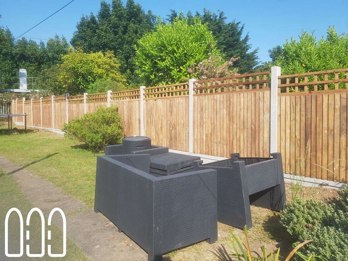 Close board fencing with concrete posts, gravel boards and a box trellis