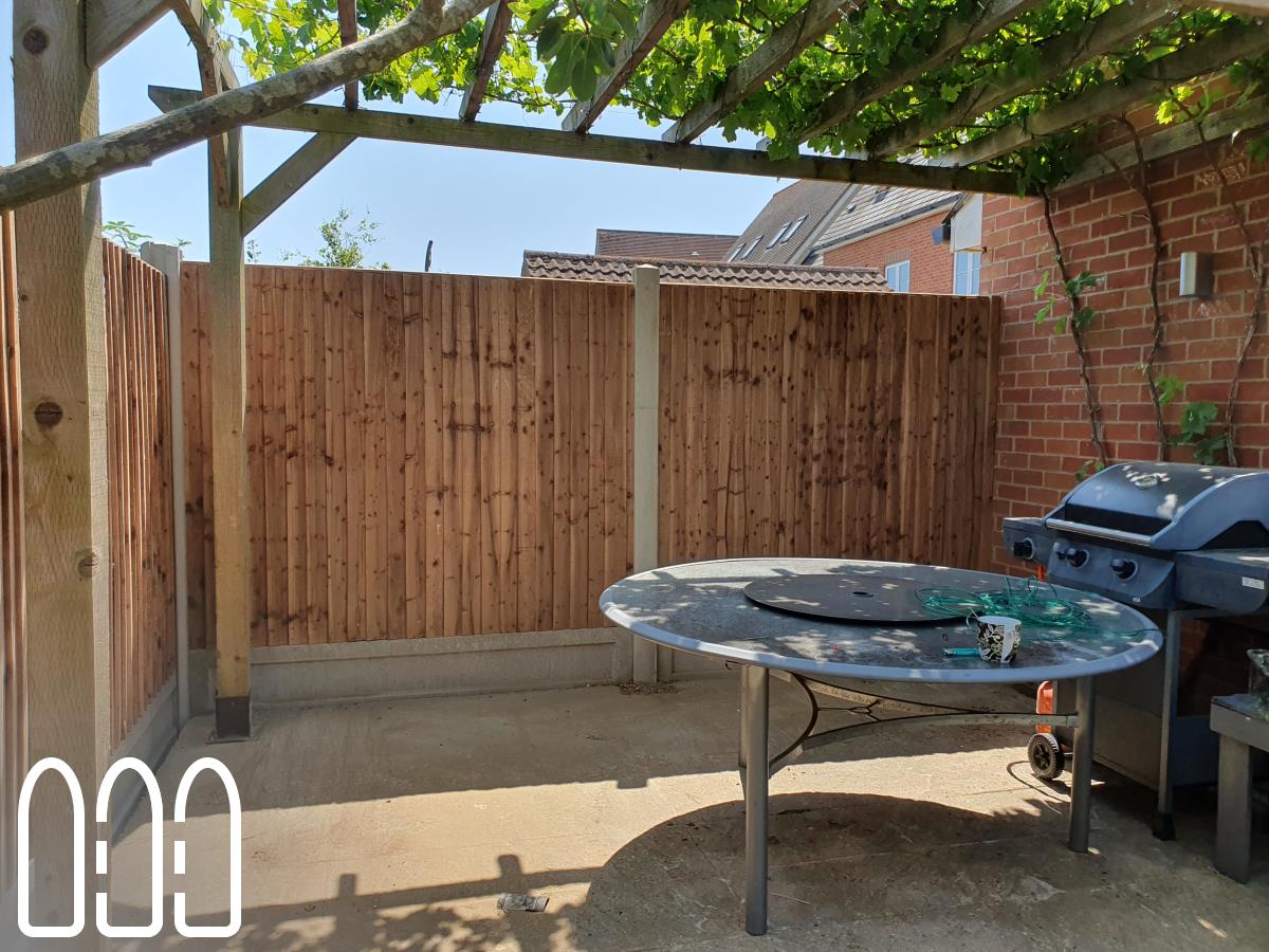 Installation of a new fence built from concrete posts, concrete gravel boards and close board feathe