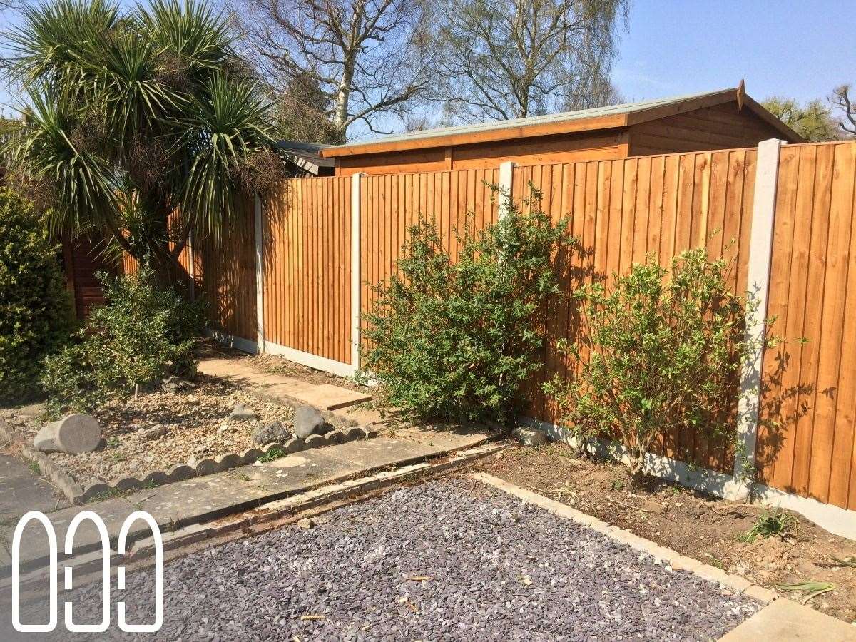 Close board fencing with concrete posts and gravel boards