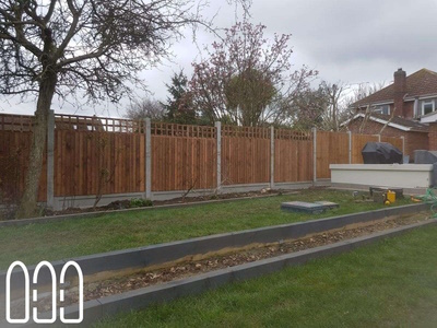Close board fencing with concrete posts, gravel boards