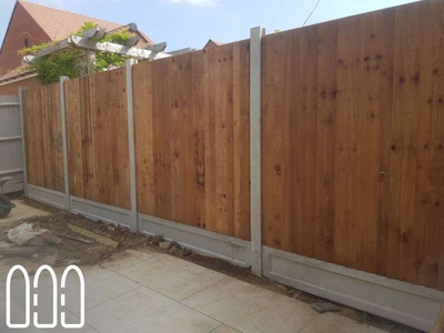 Close board fencing with concrete posts and gravel boards