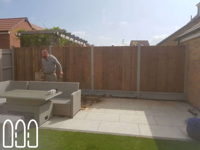 Close board fencing with concrete posts and gravel boards
