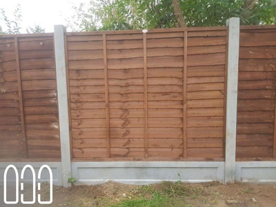 Concrete Posts and Gravel Boards with Waney Fence Panels