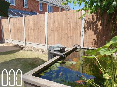Installation of a new fence built from concrete posts, concrete gravel boards and close board feather edge fence panels.